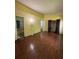 Bedroom featuring hardwood floors, a window, and an en suite bathroom at 3739 Jamestown Ct, Doraville, GA 30340