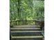 Spacious wooden deck overlooking a lush green backyard perfect for entertaining or relaxing in nature at 3739 Jamestown Ct, Doraville, GA 30340