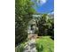 Modest two-story home with overgrown landscaping at 3739 Jamestown Ct, Doraville, GA 30340