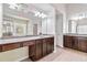 This bathroom features dual vanities, a large mirror, and tile floors at 4840 Shiloh Springs Rd, Cumming, GA 30040
