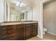 This bathroom features tile floors, a long vanity, and is connected to other rooms at 4840 Shiloh Springs Rd, Cumming, GA 30040