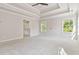 This spacious main bedroom features a tray ceiling and large windows at 4840 Shiloh Springs Rd, Cumming, GA 30040