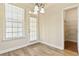 This breakfast nook features lots of natural light, a door to the outside, and pantry at 4840 Shiloh Springs Rd, Cumming, GA 30040