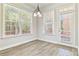 Cozy dining area featuring wood flooring, ample natural light, and access to the patio at 4840 Shiloh Springs Rd, Cumming, GA 30040