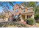 Beautiful brick home featuring a well-kept lawn, charming shutters, and an inviting front porch at 4840 Shiloh Springs Rd, Cumming, GA 30040