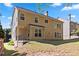 Two-story home featuring a covered patio and well-maintained lawn at 4840 Shiloh Springs Rd, Cumming, GA 30040