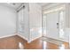 Bright foyer featuring gleaming hardwood floors, white trim, and a welcoming front door at 4840 Shiloh Springs Rd, Cumming, GA 30040
