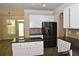 Stylish kitchen featuring white cabinets, granite countertops, and stainless steel appliances at 4840 Shiloh Springs Rd, Cumming, GA 30040