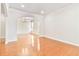 Inviting living room with hardwood floors, arched doorways, and recessed lighting at 4840 Shiloh Springs Rd, Cumming, GA 30040