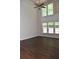 Bright living room boasts soaring ceilings, a ceiling fan, and an abundance of natural light at 4840 Shiloh Springs Rd, Cumming, GA 30040