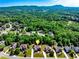 An aerial view of a lovely subdivision on a wooded lot with scenic views of the surrounding mountains at 5925 Boulder Bluff Dr, Cumming, GA 30040