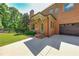 Brick home with attached garage and landscaping at 5925 Boulder Bluff Dr, Cumming, GA 30040