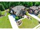 Beautiful two-story brick home with a well-manicured lawn and an attached garage at 5925 Boulder Bluff Dr, Cumming, GA 30040