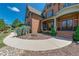 Charming front entrance with covered porch, brick facade, and lush landscaping at 5925 Boulder Bluff Dr, Cumming, GA 30040