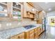 Kitchen with stainless steel appliances, gas stove, granite countertops, and wooden cabinets at 5925 Boulder Bluff Dr, Cumming, GA 30040