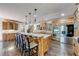 Spacious kitchen features a large island, stainless steel appliances, and wooden cabinets at 5925 Boulder Bluff Dr, Cumming, GA 30040