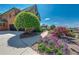 Beautiful walkway with vibrant landscaping leading to a brick home with a two-car garage at 5925 Boulder Bluff Dr, Cumming, GA 30040