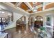 Spacious open concept living room features a piano, hardwood floors, and seamless access to other living areas at 5925 Boulder Bluff Dr, Cumming, GA 30040