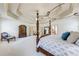 Spacious main bedroom with a trey ceiling, four-poster bed, and ensuite bathroom access at 5925 Boulder Bluff Dr, Cumming, GA 30040