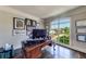 Bright home office with a large window offering scenic views and a classic wooden desk at 5925 Boulder Bluff Dr, Cumming, GA 30040