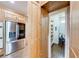 Walk-in pantry with wooden cabinets and stainless steel refrigerator at 5925 Boulder Bluff Dr, Cumming, GA 30040