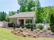 Charming pool house with an open-air lounge, surrounded by manicured landscaping and a tranquil setting at 5925 Boulder Bluff Dr, Cumming, GA 30040