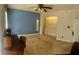 Offers ample space, a blue accent wall, ceiling fan, and a walk-in closet at 750 Dalrymple Rd # G3, Atlanta, GA 30328