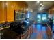 Showcases dark granite countertops, tiled backsplash, wood cabinets, and stainless steel appliances at 750 Dalrymple Rd # G3, Atlanta, GA 30328