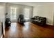 Bright living room with hardwood floors, large windows, and comfortable seating at 750 Dalrymple Rd # G3, Atlanta, GA 30328
