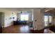 Living room featuring a brick fireplace and access to a kitchen space at 750 Dalrymple Rd # G3, Atlanta, GA 30328