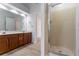 Bathroom featuring a glass shower enclosure and double sink vanity at 1912 Riverton Dr, Suwanee, GA 30024