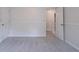 Carpeted bedroom featuring wainscoting and two doors, creating a flexible living space at 1912 Riverton Dr, Suwanee, GA 30024