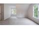 Cozy carpeted room with natural lighting and a view, ideal for relaxation at 1912 Riverton Dr, Suwanee, GA 30024