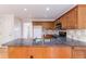 Open kitchen with granite countertops, stainless steel appliances, and hardwood floors at 1912 Riverton Dr, Suwanee, GA 30024