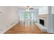 Inviting living room with a fireplace, hardwood floors and french doors to the deck at 1912 Riverton Dr, Suwanee, GA 30024