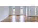 Bright living room with hardwood floors, white trim and an open floorplan concept at 1912 Riverton Dr, Suwanee, GA 30024