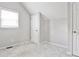 Cozy bedroom with plush carpet, neutral walls, and ample natural light from a window at 318 Glenwood Se Ave, Atlanta, GA 30312