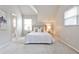 Bedroom showcasing neutral tones, plush carpet, and coordinated decor with ensuite bath at 318 Glenwood Se Ave, Atlanta, GA 30312