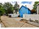 Charming blue home featuring a private fenced yard and driveway at 318 Glenwood Se Ave, Atlanta, GA 30312