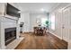 Living and dining area boasts a fireplace, stainless steel appliances, and ample lighting at 318 Glenwood Se Ave, Atlanta, GA 30312