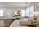 Elegant living room featuring hardwood floors, neutral furniture, and a modern aesthetic at 318 Glenwood Se Ave, Atlanta, GA 30312