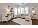 Bright living room with hardwood floors, neutral furniture, and ample natural light at 318 Glenwood Se Ave, Atlanta, GA 30312