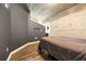 Neutral bedroom with concrete ceiling and accent wall at 400 W Peachtree Nw St # 3614, Atlanta, GA 30308