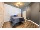 Modern bedroom with painted brick wall and wood-look floors at 400 W Peachtree Nw St # 3614, Atlanta, GA 30308