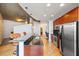 Modern kitchen with stone countertops, stainless steel appliances, hardwood floors and island with seating at 400 W Peachtree Nw St # 3614, Atlanta, GA 30308