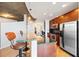 Modern kitchen with stone countertops, stainless steel appliances, hardwood floors and island with seating at 400 W Peachtree Nw St # 3614, Atlanta, GA 30308