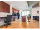 Modern kitchen with stainless steel appliances, dark cabinets, hardwood floors and eat-in island at 400 W Peachtree Nw St # 3614, Atlanta, GA 30308
