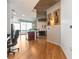 Open-concept living area with hardwood floors, modern lighting, a kitchen island, and floor-to-ceiling windows at 400 W Peachtree Nw St # 3614, Atlanta, GA 30308