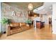 Stylish living room with exposed brick wall, modern lighting, and hardwood floors at 400 W Peachtree Nw St # 3614, Atlanta, GA 30308