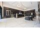 Elegant lobby with modern lighting, white marble floors, dark wood paneling, and comfortable seating area at 400 W Peachtree Nw St # 3614, Atlanta, GA 30308